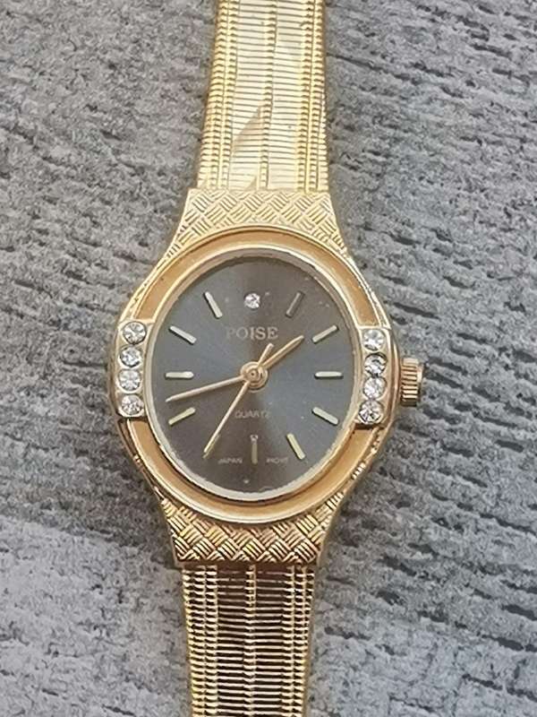 LADIES ALL GOLD PLATED POISE WATCH IN EXCELLENT WORKING CONDITION