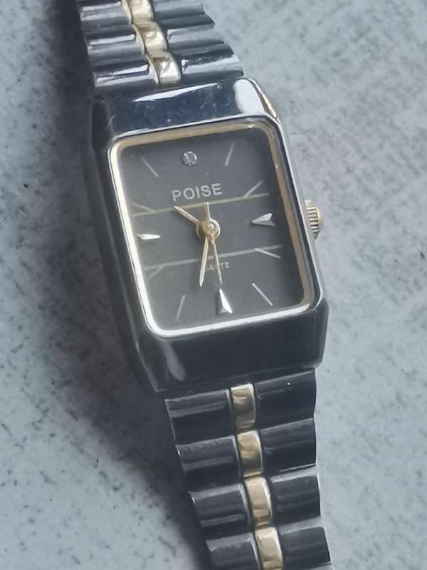 STUNNING LADIES POISE BLACK AND GOLD WATCH IN EXCELLENT WORKING CONDITION