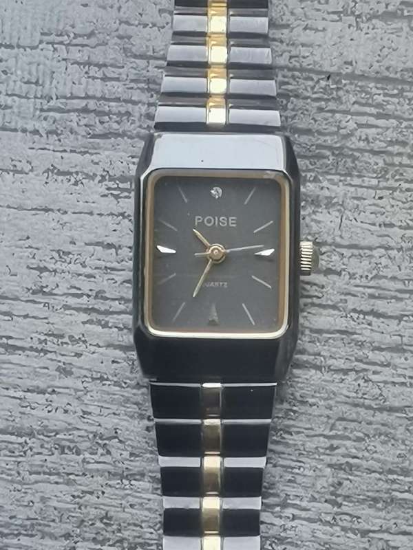 STUNNING LADIES POISE BLACK AND GOLD WATCH IN EXCELLENT WORKING CONDITION