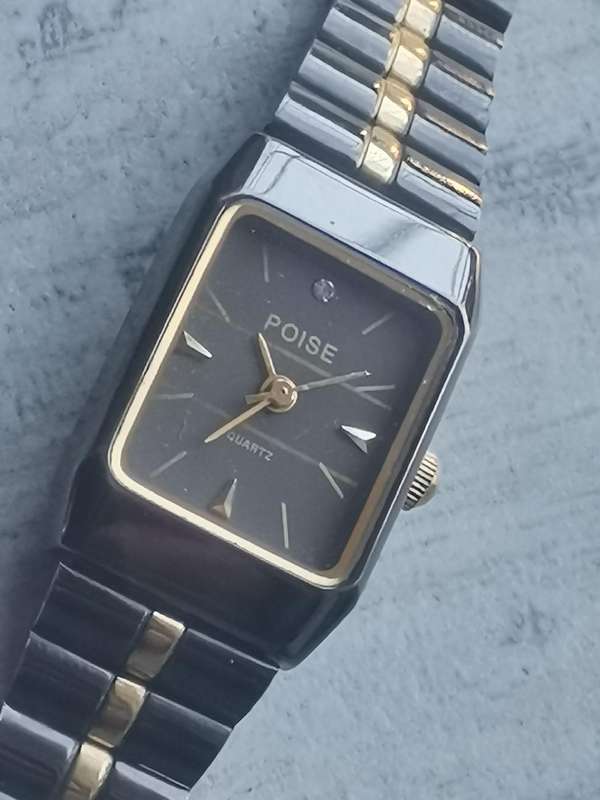 STUNNING LADIES POISE BLACK AND GOLD WATCH IN EXCELLENT WORKING CONDITION