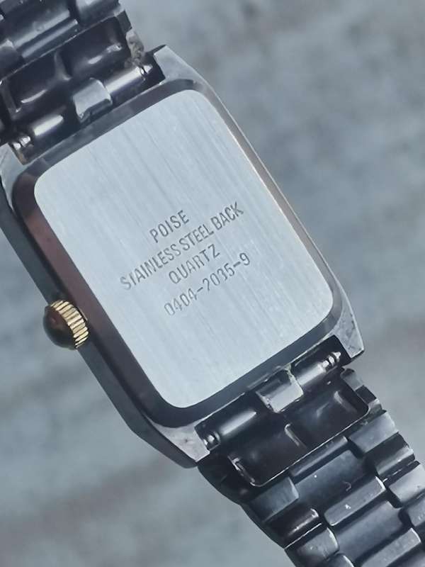 STUNNING LADIES POISE BLACK AND GOLD WATCH IN EXCELLENT WORKING CONDITION