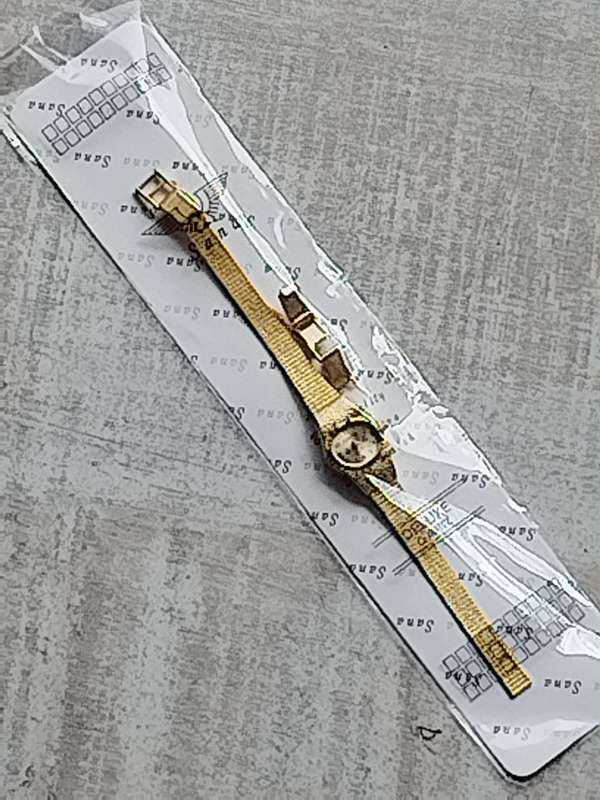 LADIES GOLD WATCH UNWORN STILL IN PLASTIC