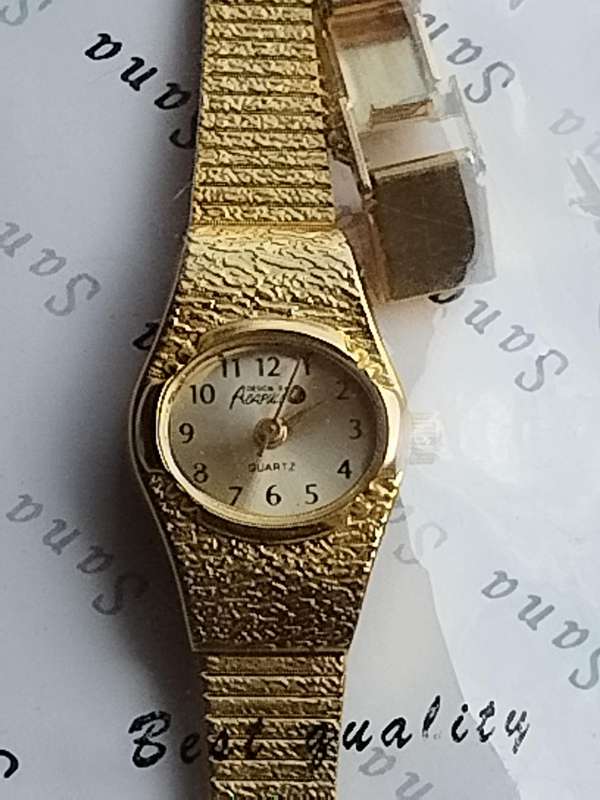 LADIES GOLD WATCH UNWORN STILL IN PLASTIC