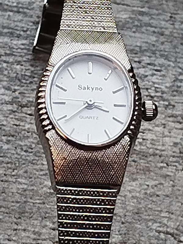 LADIES SAKYNO STAINLESS STEEL WATCH IN EXCELLENT WORKING CONDITION