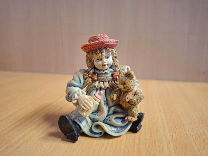 Girl Figurine with Teddy Bear  (height 7cm width 7cm depth 4cm)