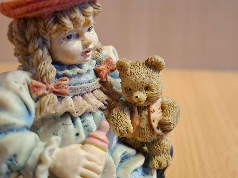 Girl Figurine with Teddy Bear  (height 7cm width 7cm depth 4cm)