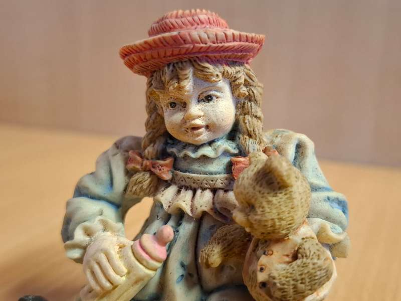 Girl Figurine with Teddy Bear  (height 7cm width 7cm depth 4cm)