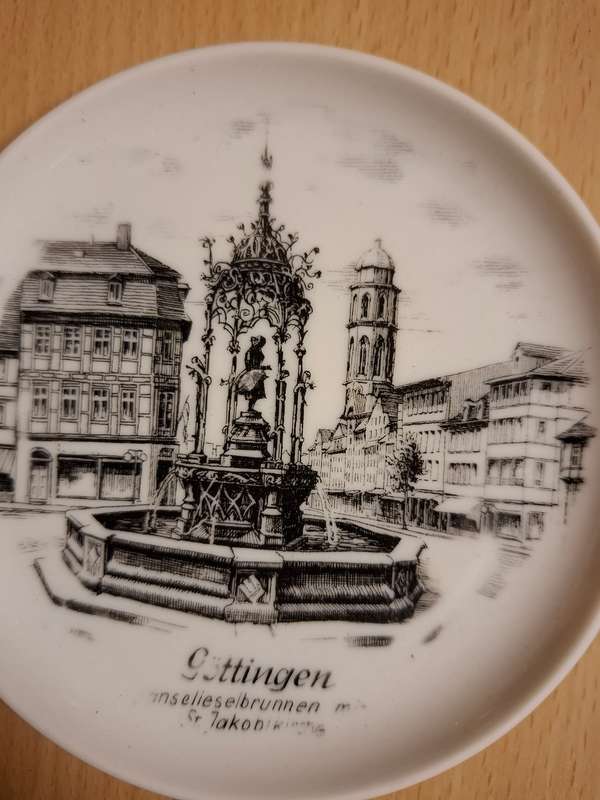 Small Round Kaiser Souvenir Plate - Goose Girl Fountain in Gottingen, Germany - width 10cm