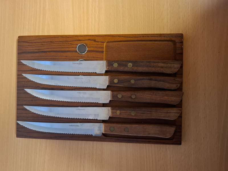 Set of 5 Steak Knives on a Wooden Board