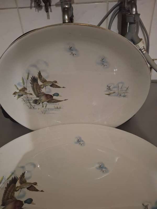 A vintage pair of flying ducks sence serving platters
