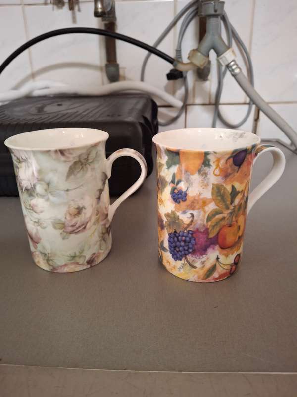Two maxwell williams procelain mugs