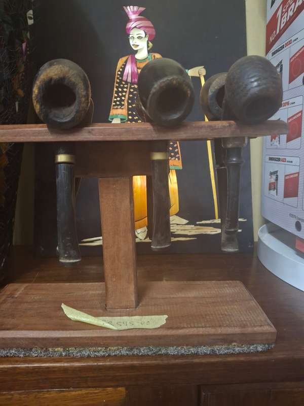 Wooden pipes on stand
