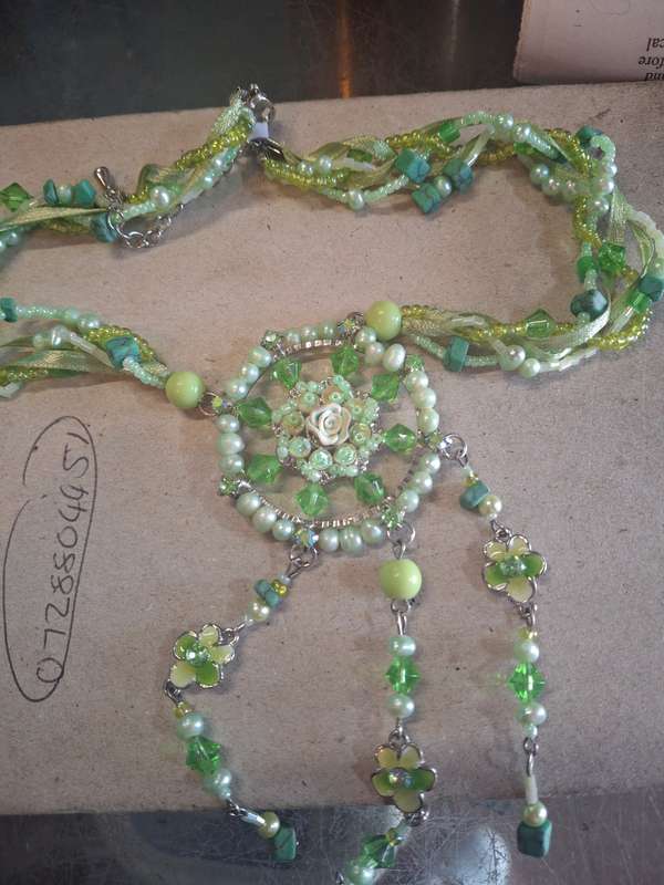 Green pretty costume necklace with flowers
