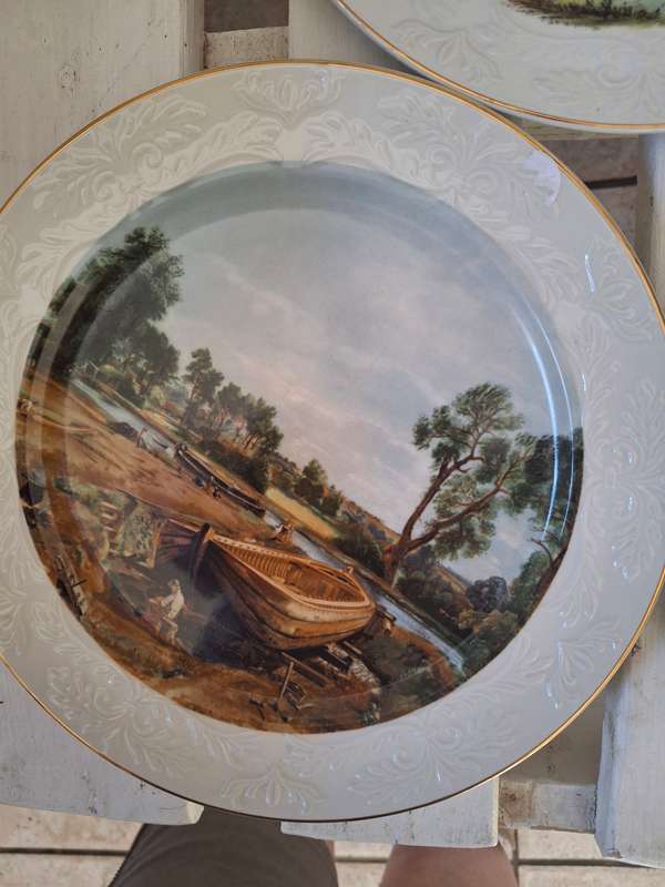 A set of three collectable wood and sons plates