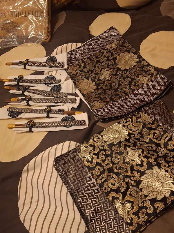 Oriental silk place mats and chop sticks