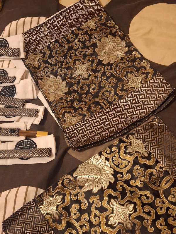 Oriental silk place mats and chop sticks