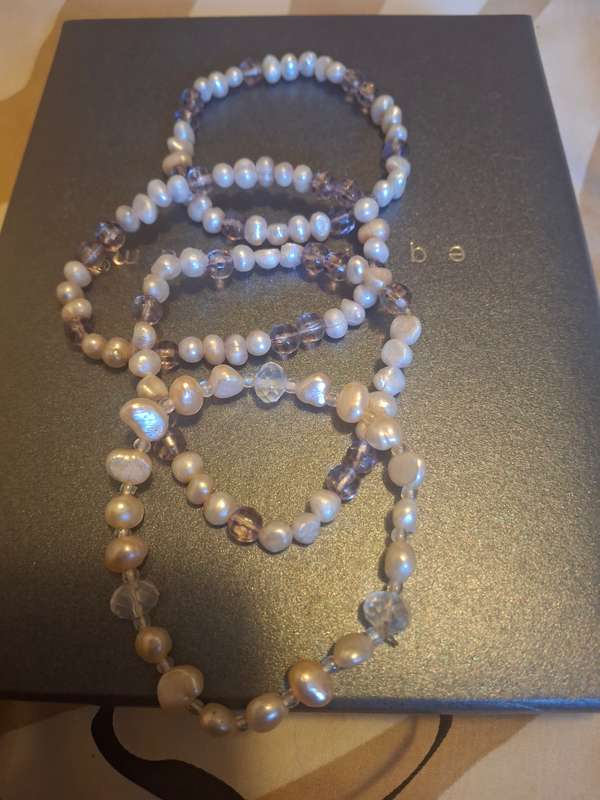 Three pearl bangles