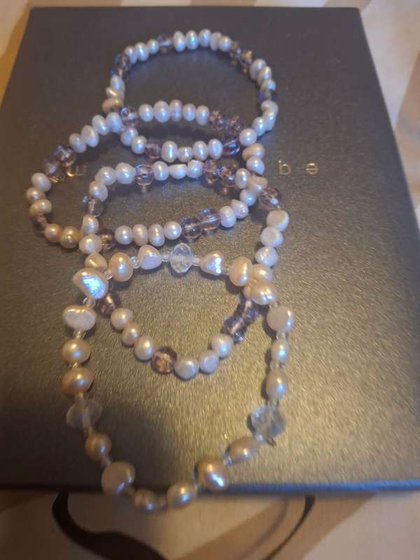 Three pearl bangles