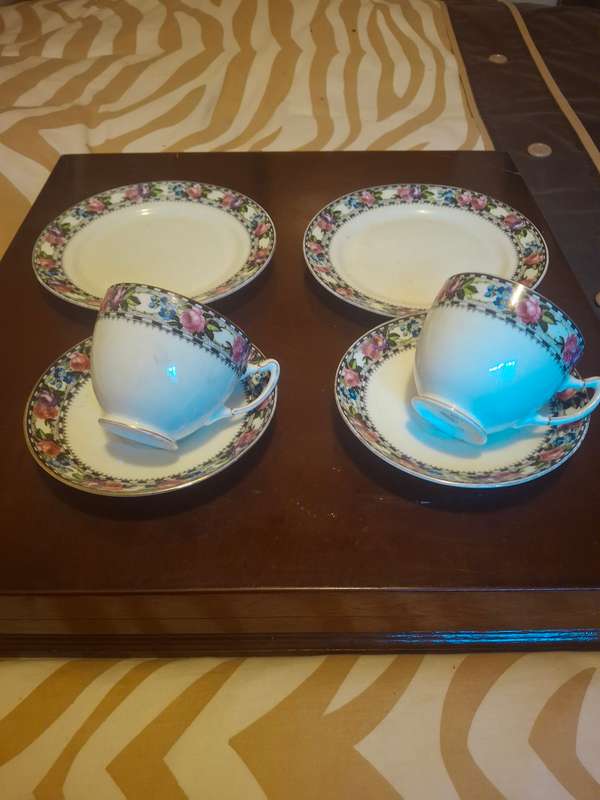 A pair of paragon tea cup trios
