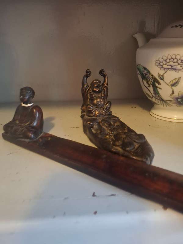 Two wooden inscene holders