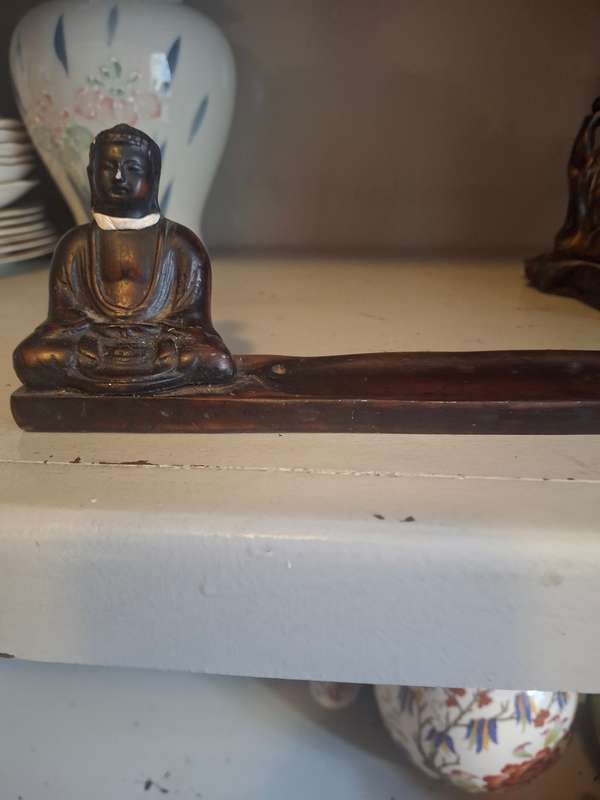 Two wooden inscene holders