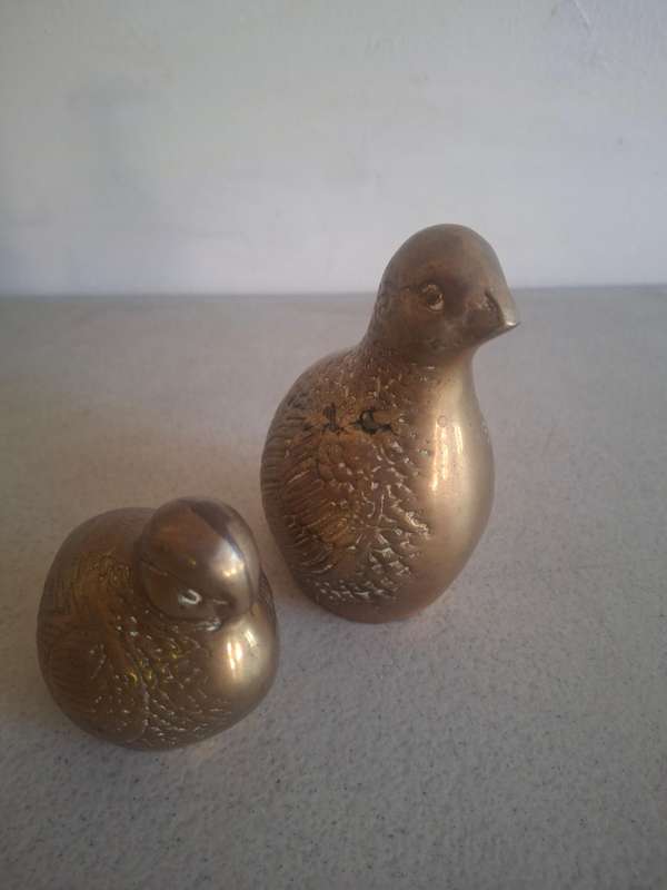 A pair of stunning brass birds