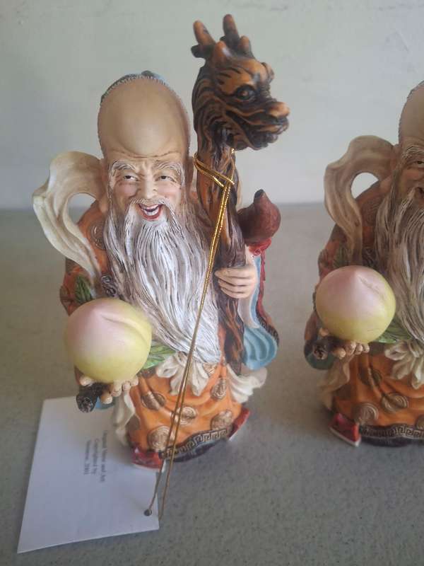 Two monk figurines