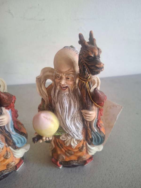 Two monk figurines