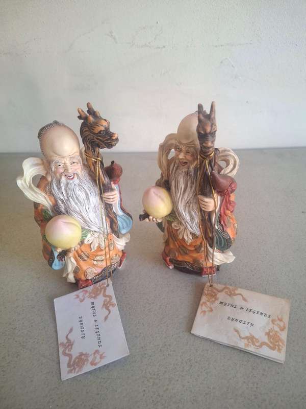 Two monk figurines