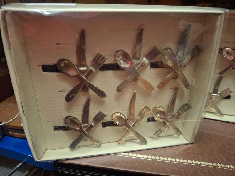 Two boxed sliver plated napkin rings