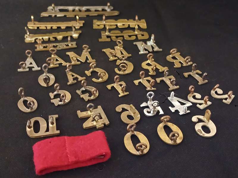 35 X SHOLDER TITLES AND NUMERALS        ( ONE BID FOR THE LOT )           L273