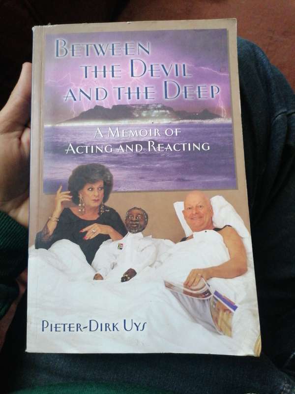 BETWEEN THE DEVIL AND THE DEEP A MEMOIR OF ACTING AND REACTING by Pieter - Dirk Uys