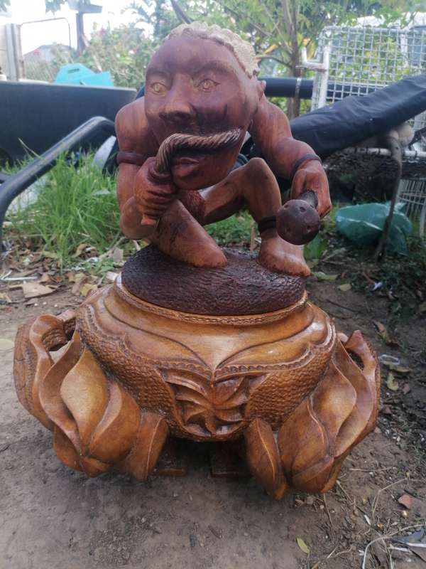 Stunning solid wood carved pot with figure