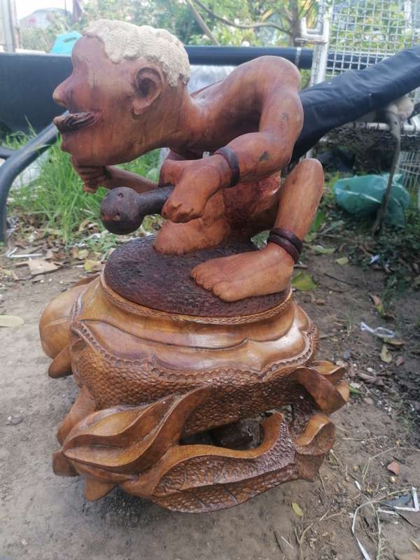 Stunning solid wood carved pot with figure