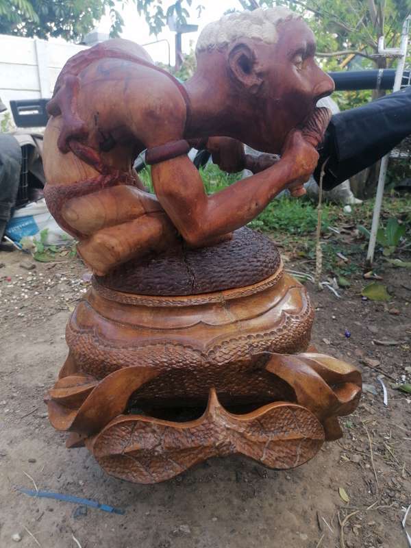 Stunning solid wood carved pot with figure