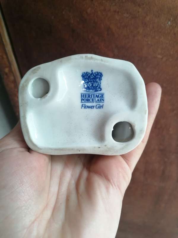 Heritage porcelain glower girl