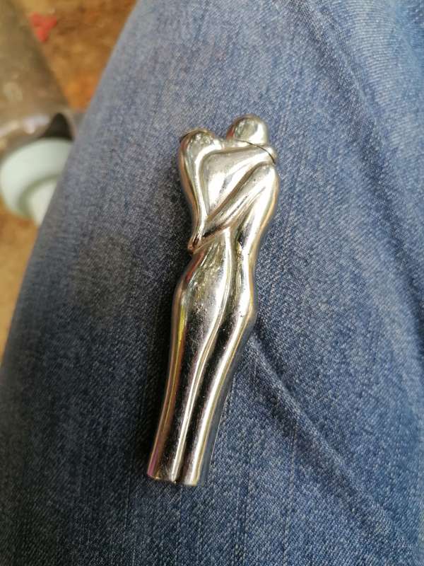 Vintage nude man and women kissing lighter