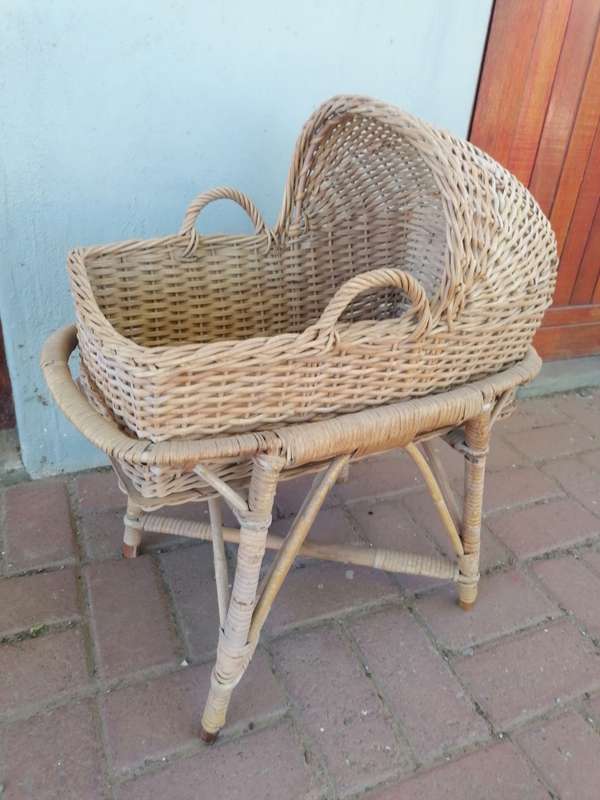 Small vintage rattan doll bed