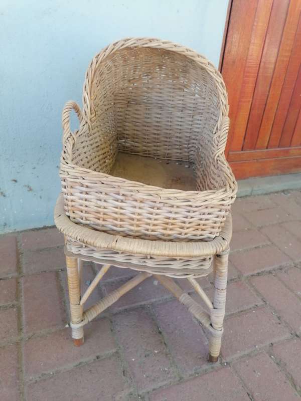 Small vintage rattan doll bed