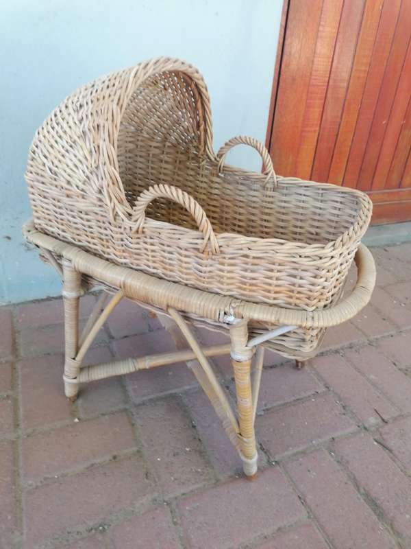 Small vintage rattan doll bed