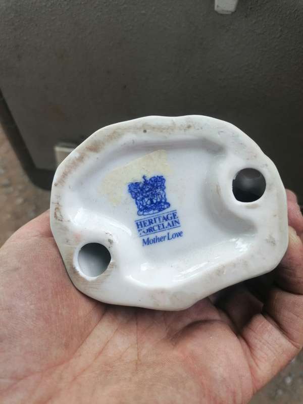 Heritage porcelain mother love. Chip to ear small crack on other