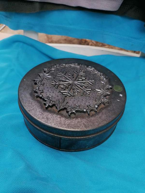 Vintage snowflake tin