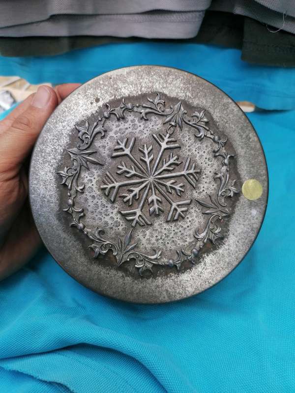 Vintage snowflake tin