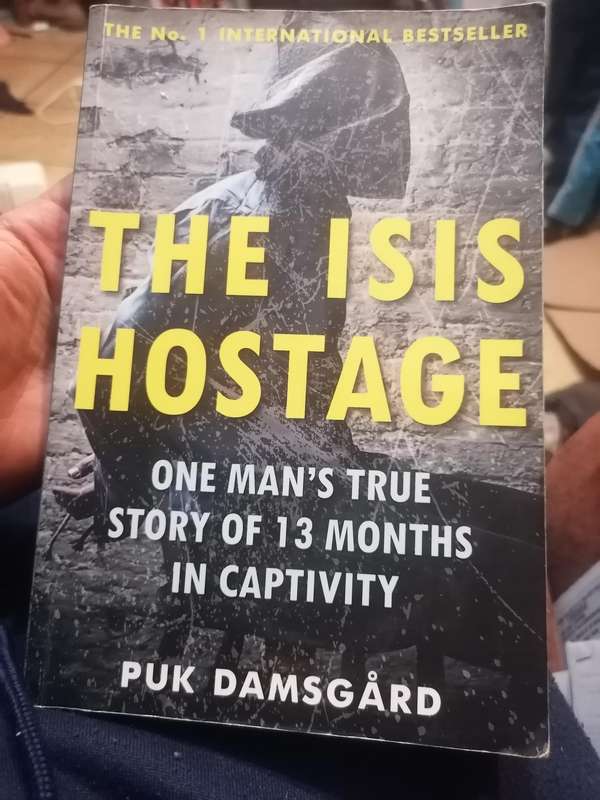 The ISIS Hostage: One Man's True Story of 13 Months in Captivity Book by Puk Damsgård