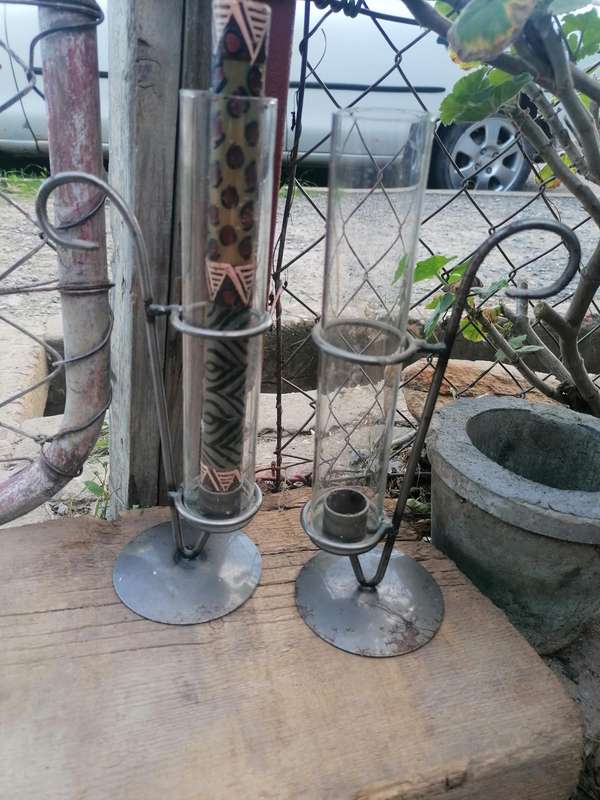 Pair of candle holders with glass