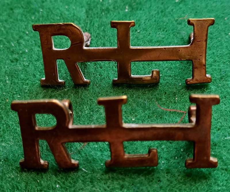 SA UDF, Rand Light Infantry brass titles, pair, worn 1914, Owen 2195