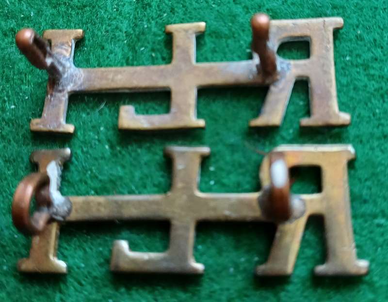 SA UDF, Rand Light Infantry brass titles, pair, worn 1914, Owen 2195