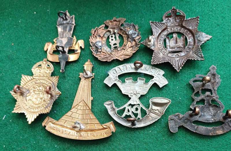Selection of 7 Military cap badges