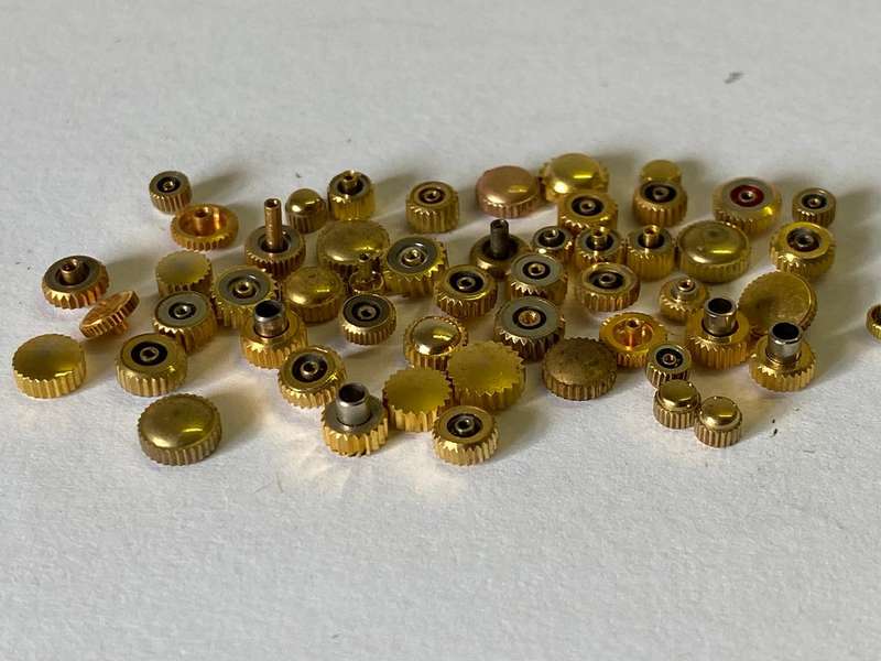 Assorted gold watch crowns - 50+ pieces