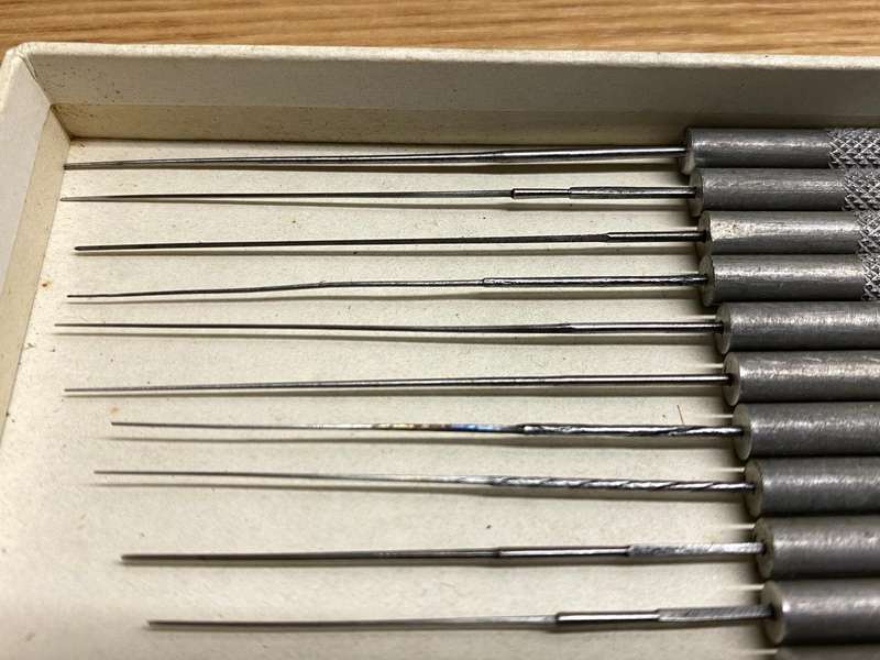 Watchmakers/jewelers cutting & smoothing broaches
